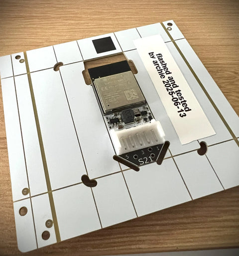 Faikin electronic component on a white grid mat with text "flashed and tested by Archie 2025--6-13".