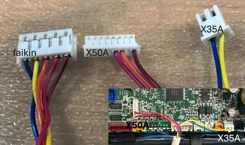 Wiring harnesses with connectors labeled X50A, X35A, and Faikin on a wooden surface.