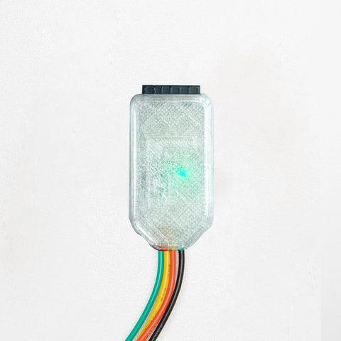 Translucent electronic component with multicolored wires on a white background