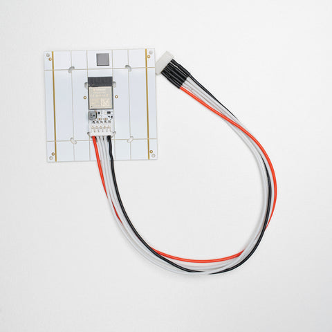 Extension Type cable is plugged into a complete board on a white background 
