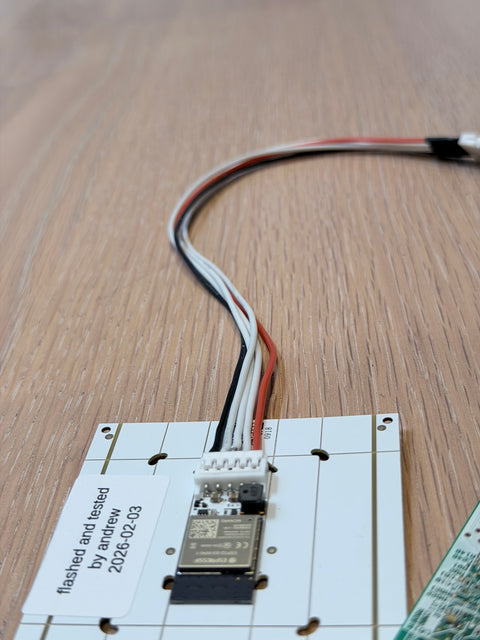 A 300mm Faikin Extension cable is plugged into the back of a Faikin board.
