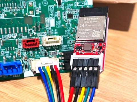 Faikin electronic component with ESP32 chip on a printed circuit board.